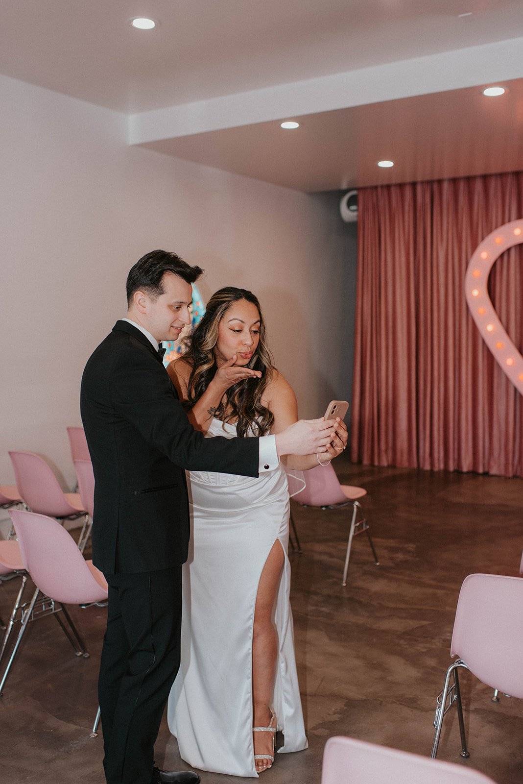 Alicia & Chris exchanging private vows during their desert elopement at Sure Thing Chapel, Dry Lake Bed, Las Vegas. Captured by Brittany Lo Photo.