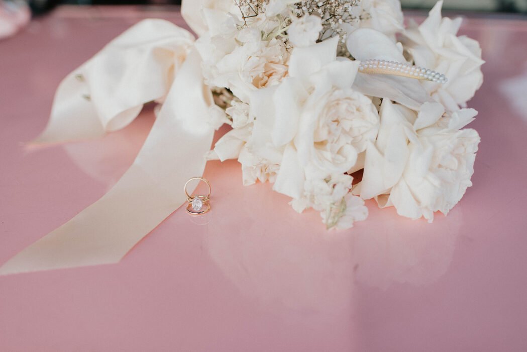 Missy & Zach exchanging vows at Sure Thing Chapel, Little White Chapel, Neon Museum, and Cosmo Hotel in Las Vegas. Captured by Brittany Lo Photo.