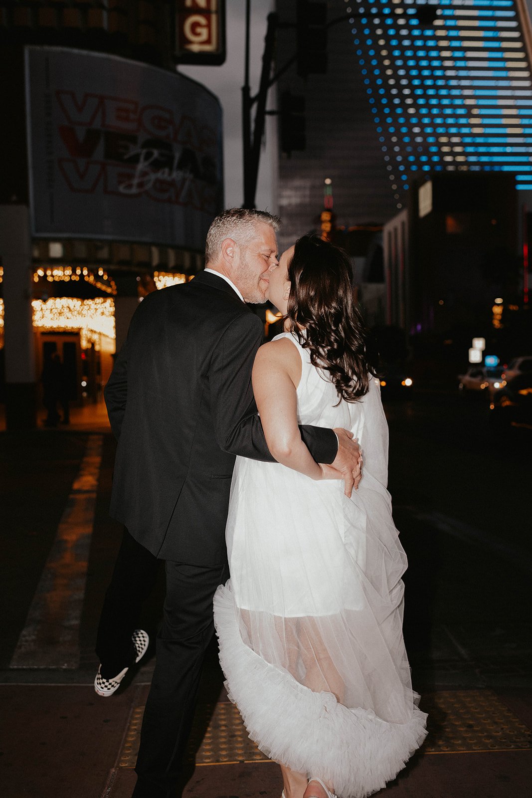 a downtown las vegas little white chapel elopement with neon lights at the plaza hotel carousel bar