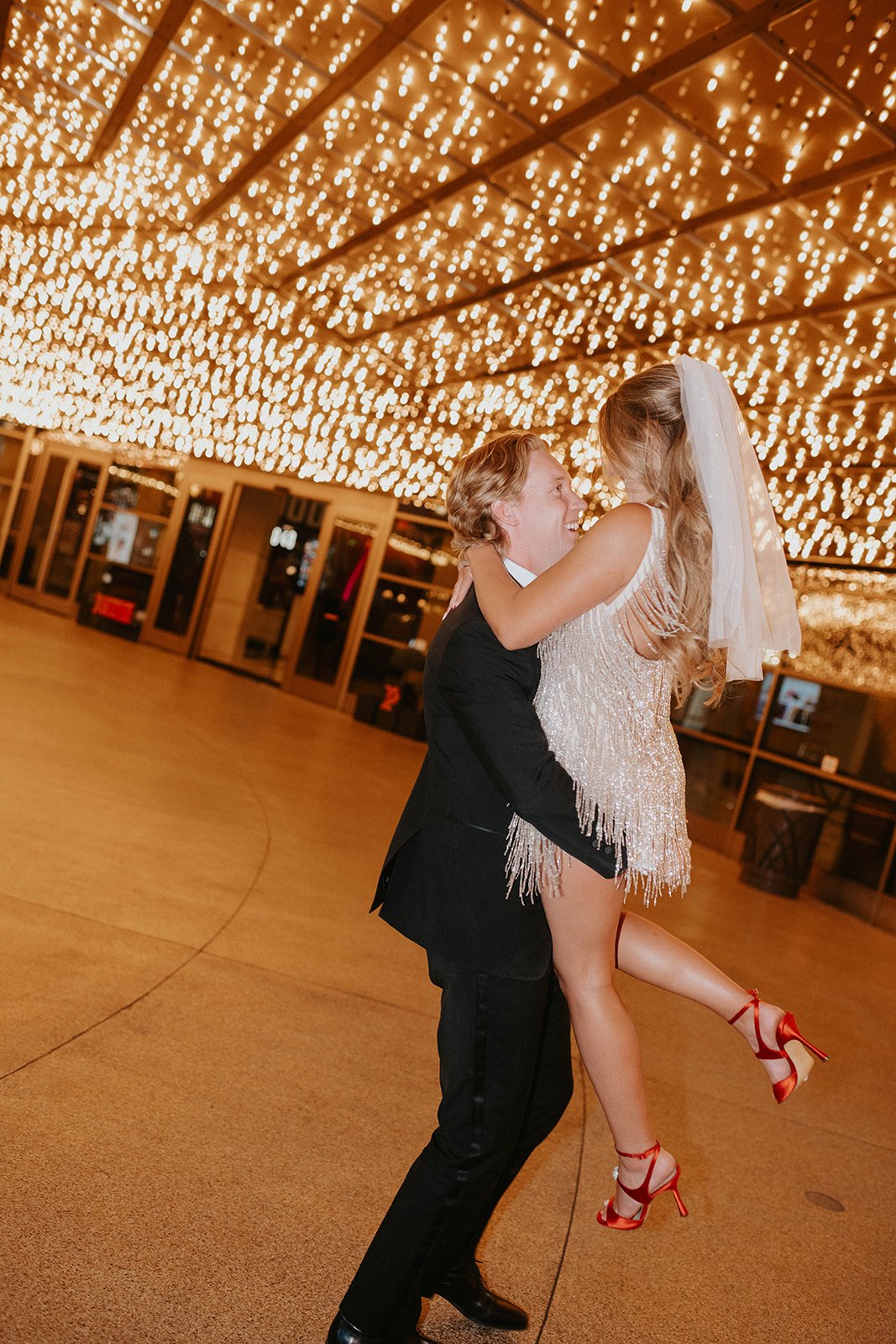 Madi Dom downtown las vegas a little white chapel magic show elopement neon lights at plaza hotel carousel bar